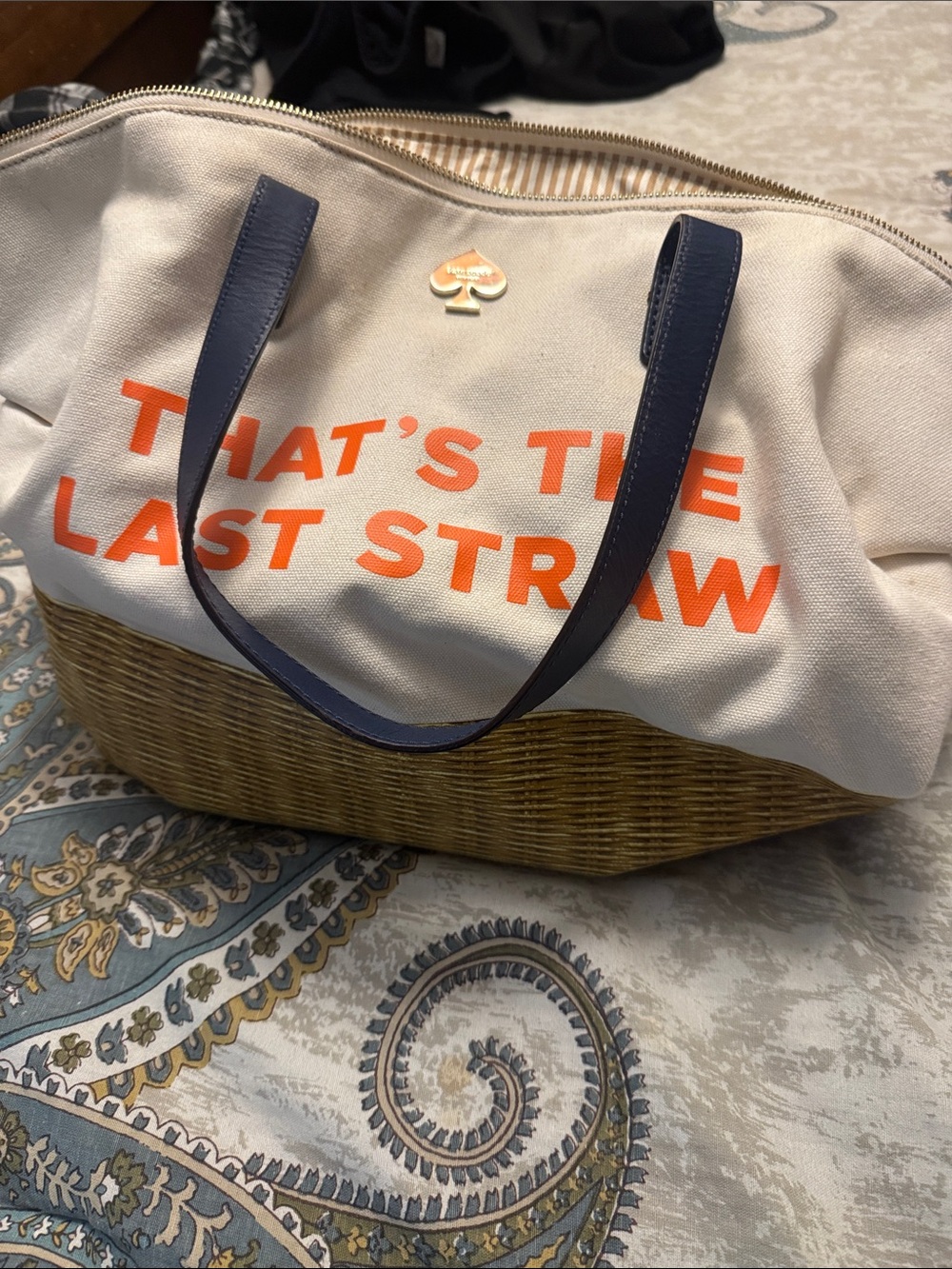 kate spade canvas tote with orange That’s the last straw text and blue handles.